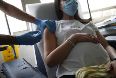RFK Jr. says healthy pregnant women don't need COVID boosters. Here's what the science says